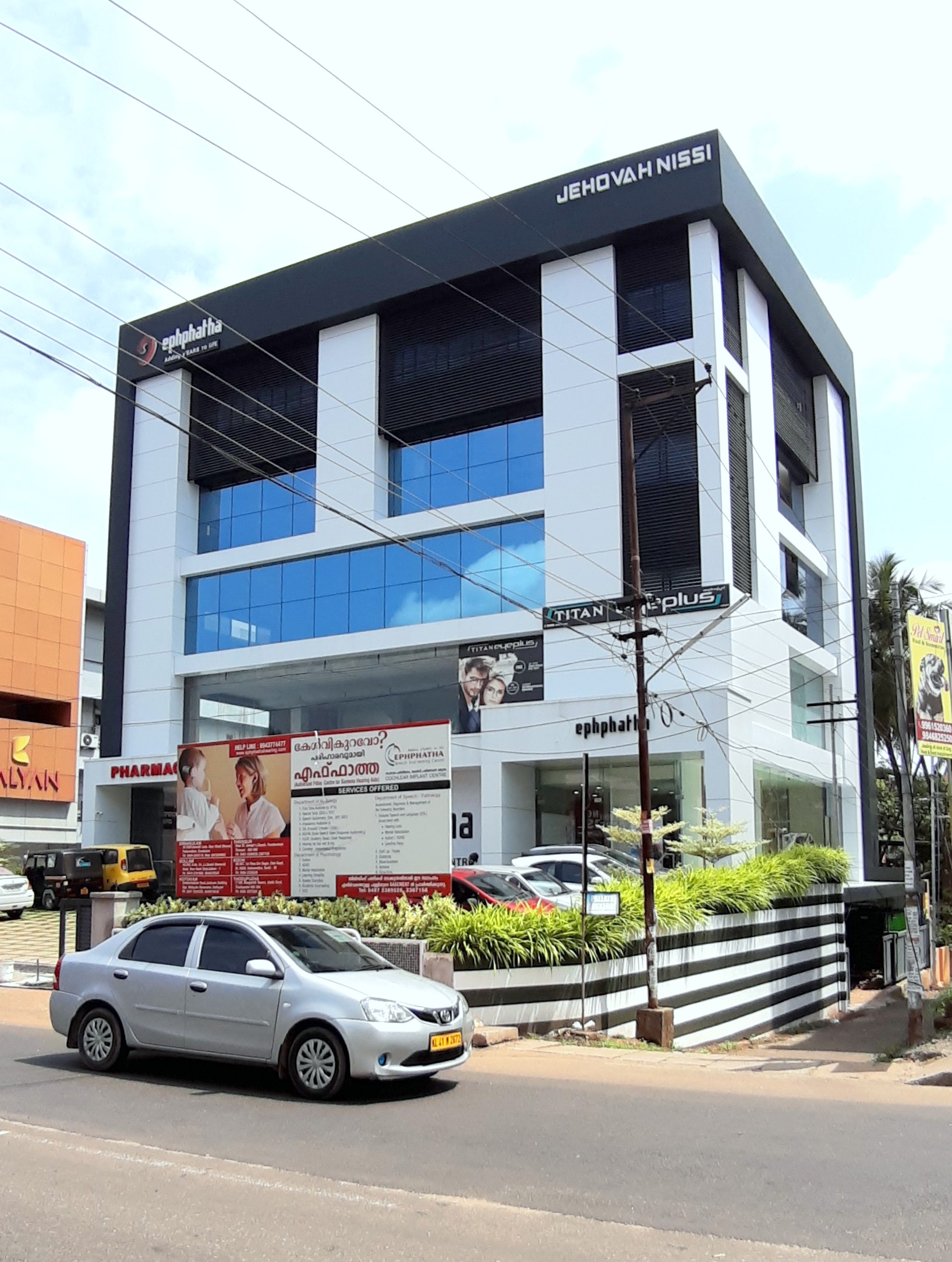 Rajesh ambooken - commercial building at punkunnam